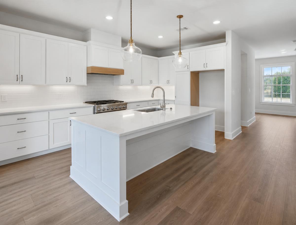 Newly built kitchen with dust-free cabinetry and spotless countertops after post-construction final cleaning